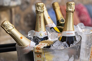 Several bottles of chandon are in a bucket of ice