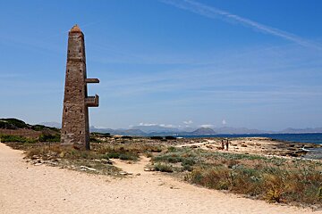 a thin stone watch tower